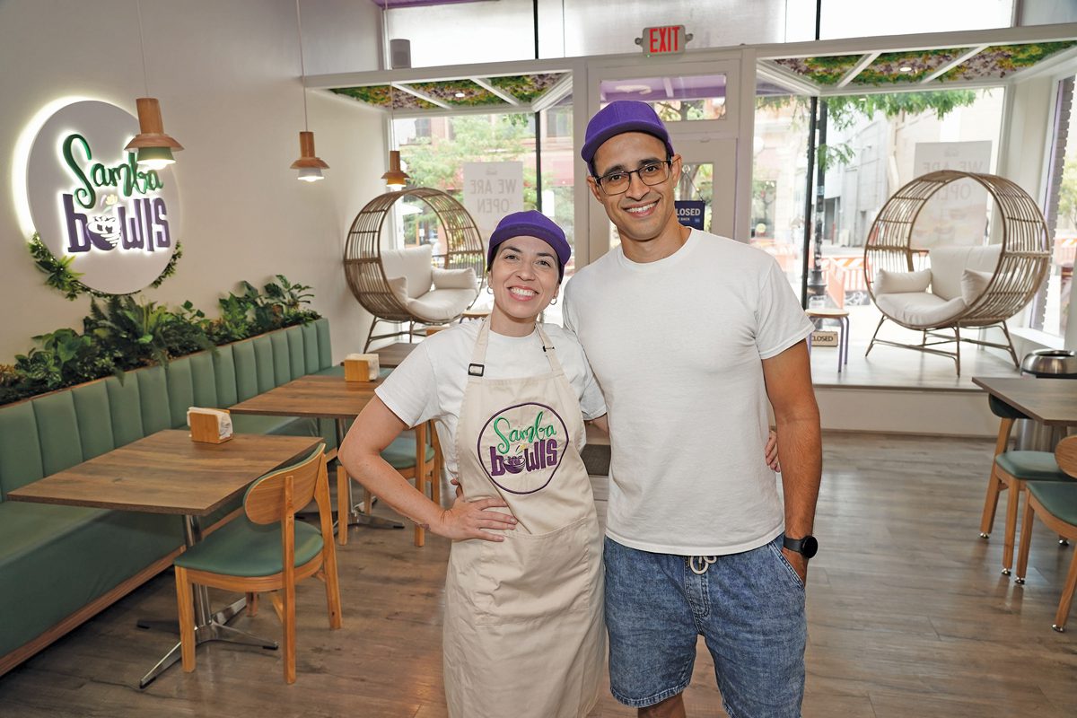 Two people standing in a restaurant.