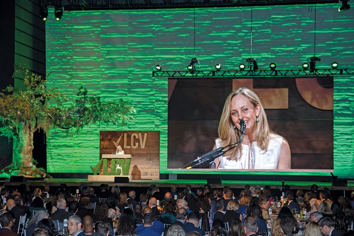 Lisa Wozniak onstage receiving an award.