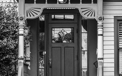 A black and white photo of a door.