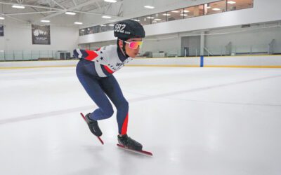 Jace Mendoza skating in an ice rink.