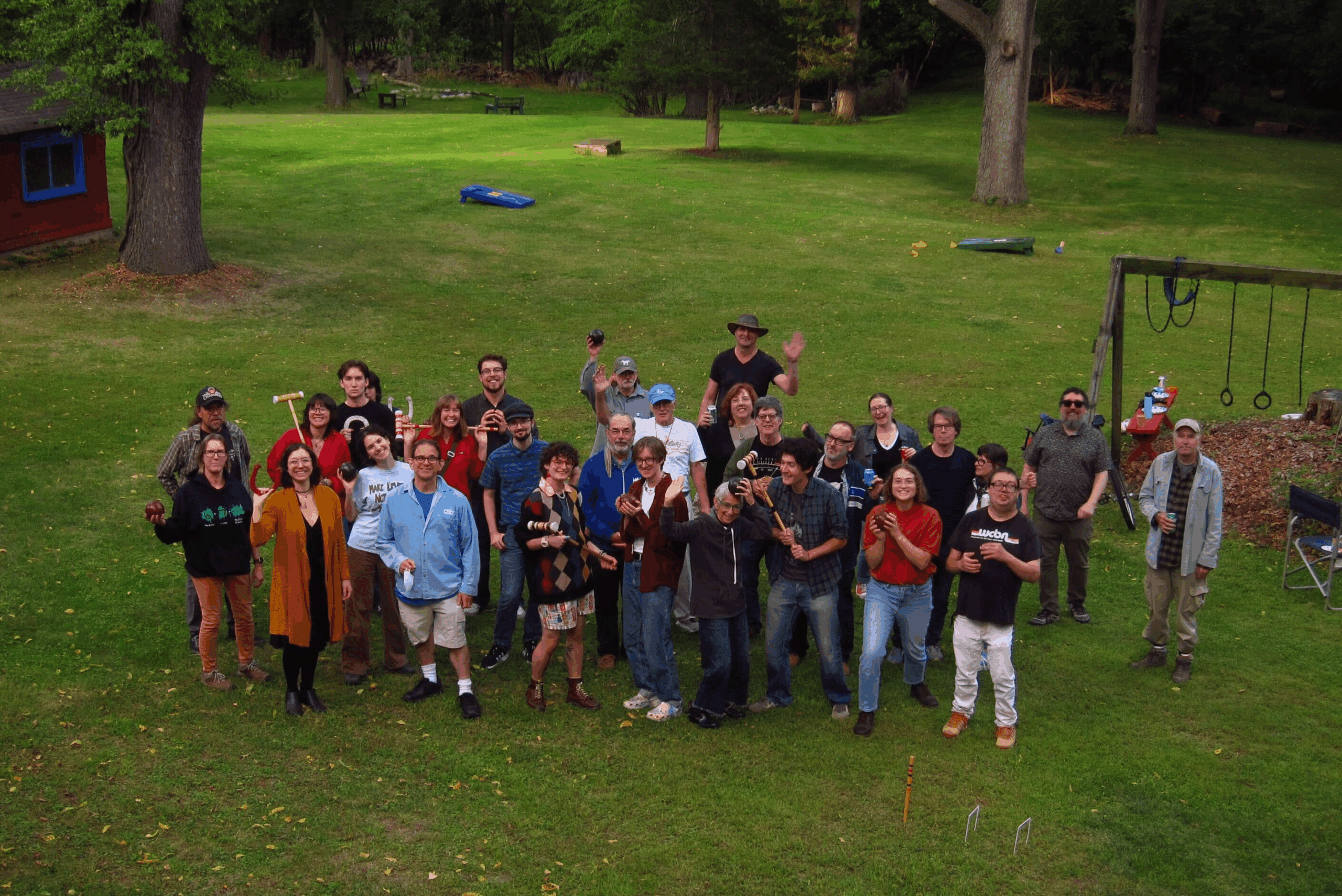 A group of people standing in a field.