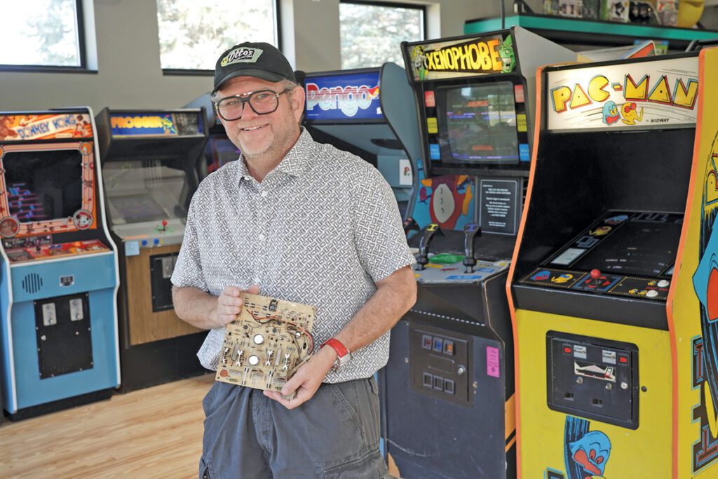Mitchell Rohde stands in an arcade.