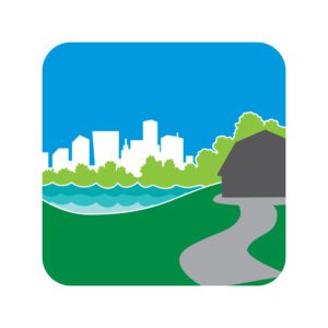 illustration of a barn near water with a city in the background