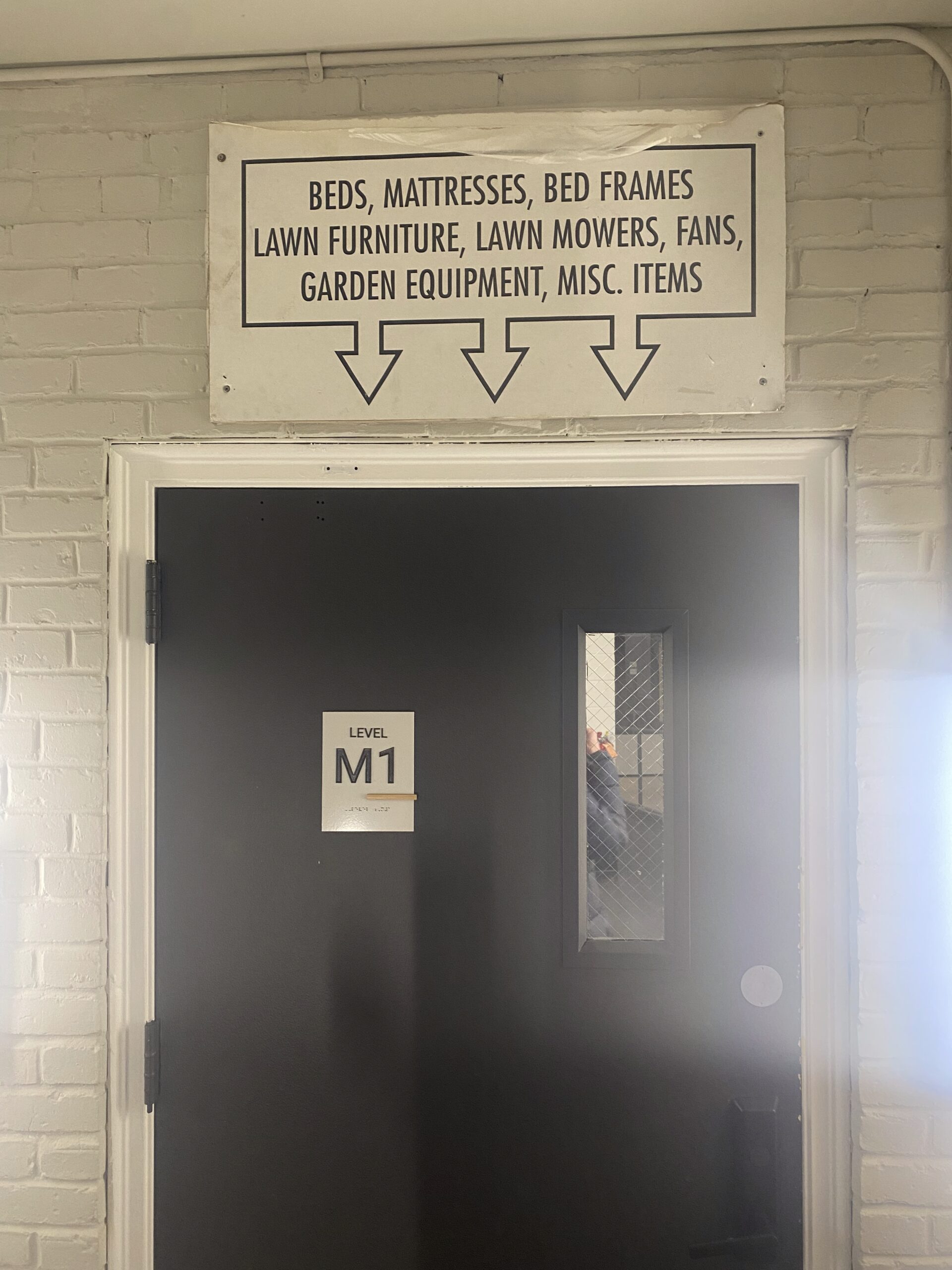 A doorway with a sign above it