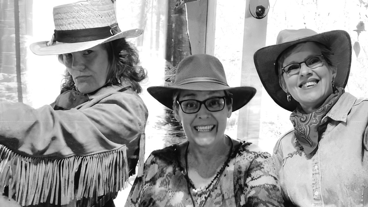 Three women dressed in Western-themed clothing.