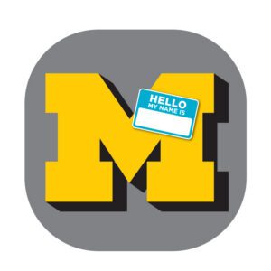 Large M illustration, for the University of Michigan, wearing a name tag