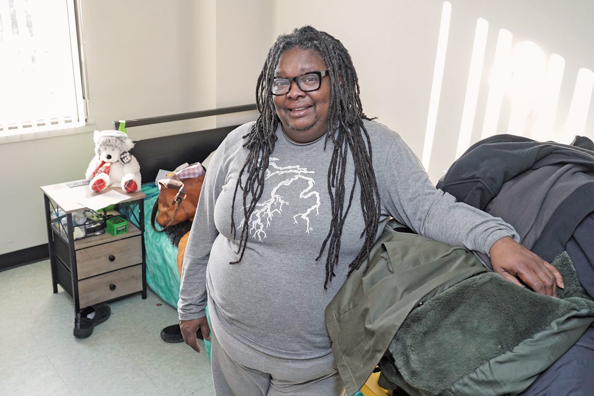 Deseree Myles poses in her room at the Delonis Center. 