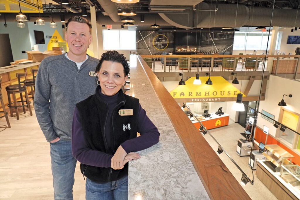 Rick Marshall and Donna Wright stand in Harvest Market.