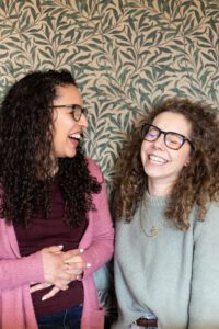 Christine Rodrigues and Sarah Williams share a laugh.
