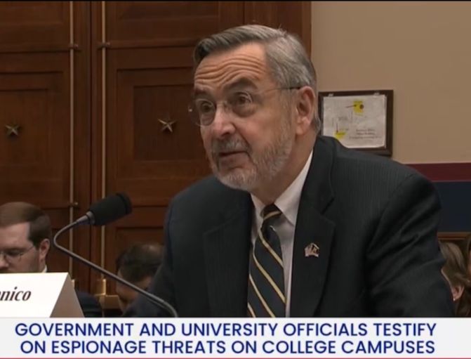 man testifying before Congress