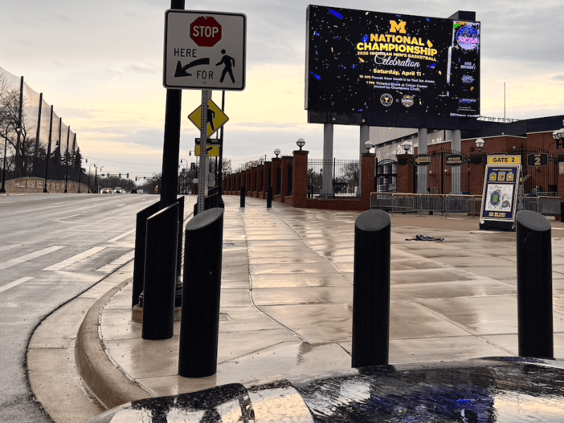 Sign outside stadium in rain