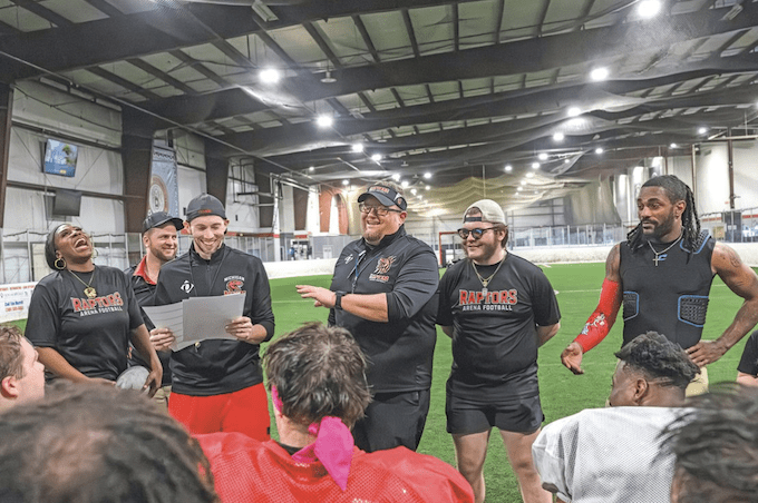 group of athletes in a meeting