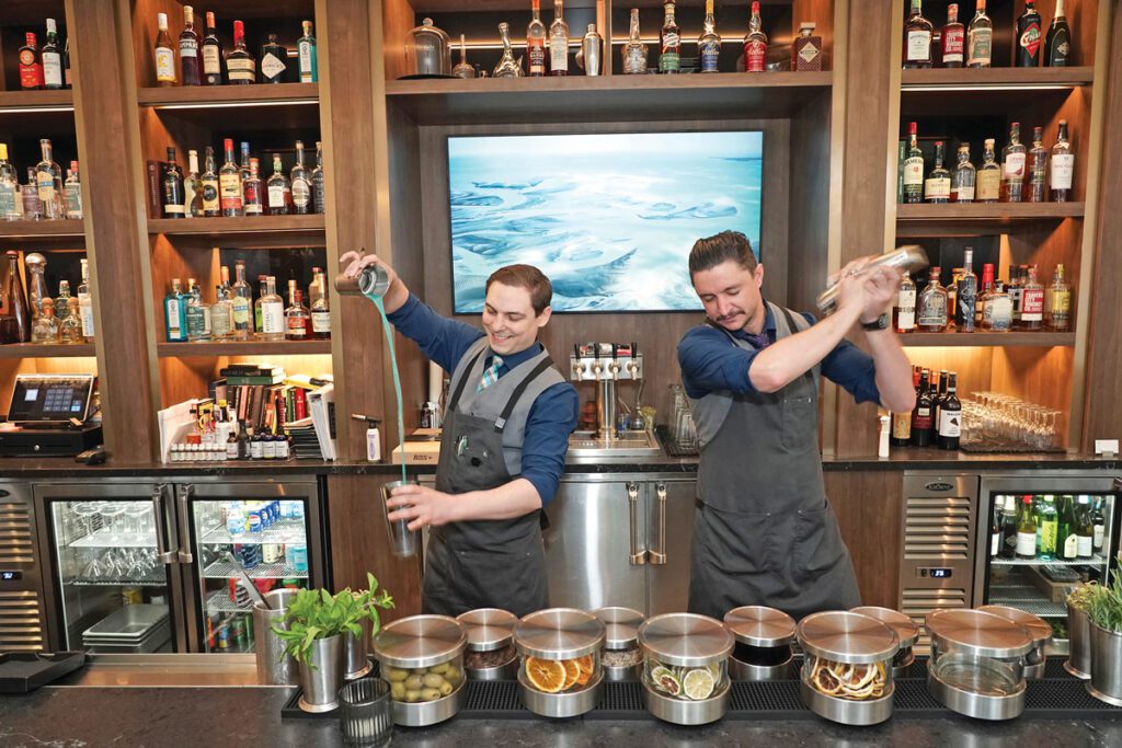Casey Miller and Ian Youngs making drinks in the AC Lounge