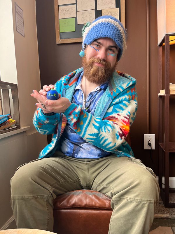 Chris Kovach holding one of his blueberries