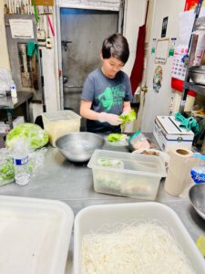 Yang's son helps out in her brother's restaurant on a recent trip to Arizona. | Courtesy: Michelle Yang