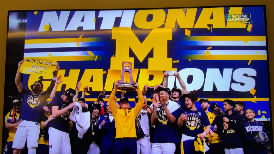 basketball team celebrates on TV