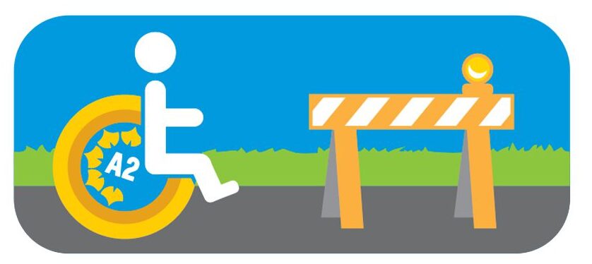 Illustration of a person in a wheelchair with the A2 Summer Streets logo in front of a barricade