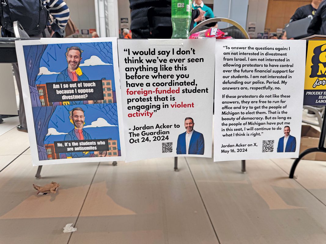 Three signs taped to a table