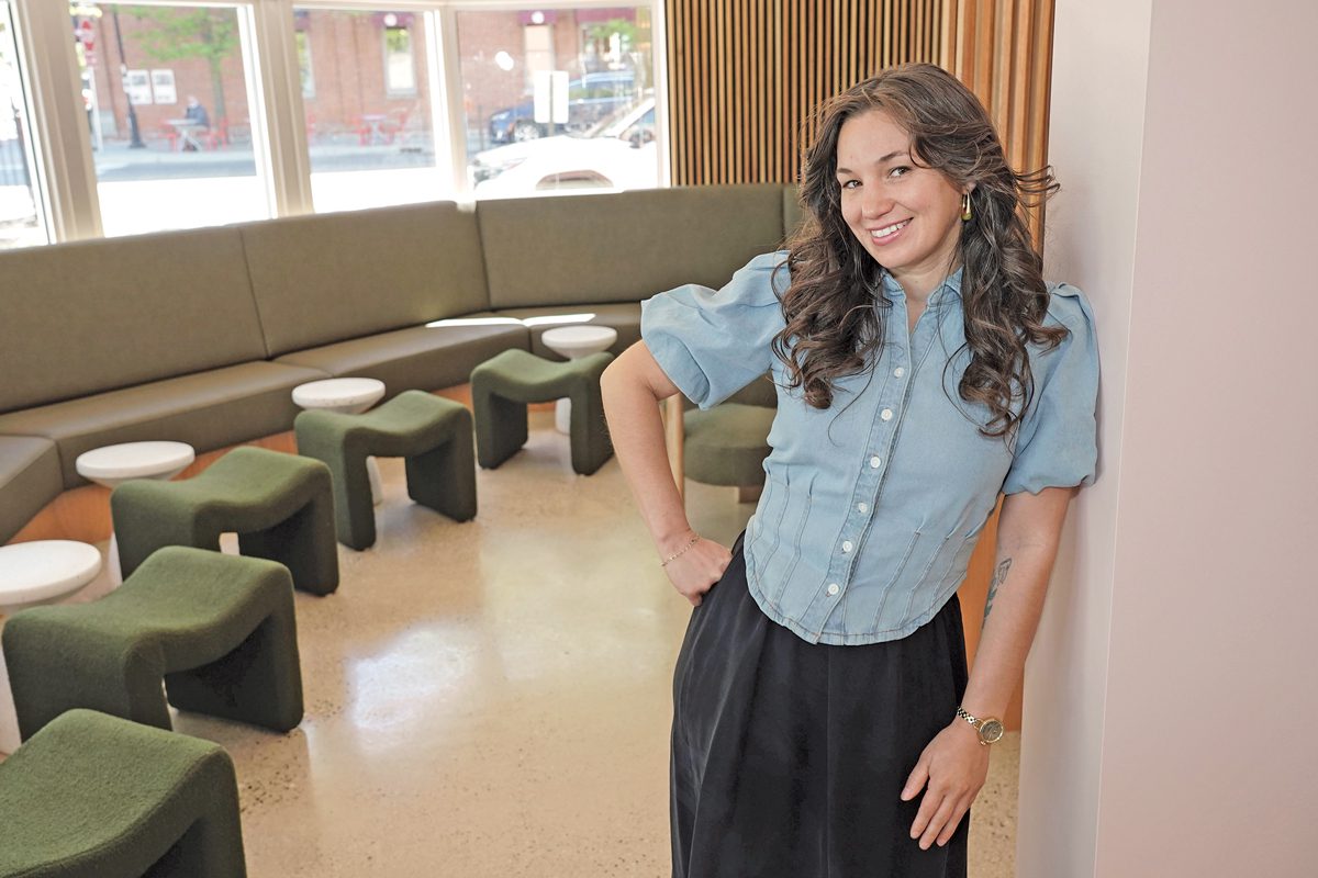 A woman stands in a restaurant