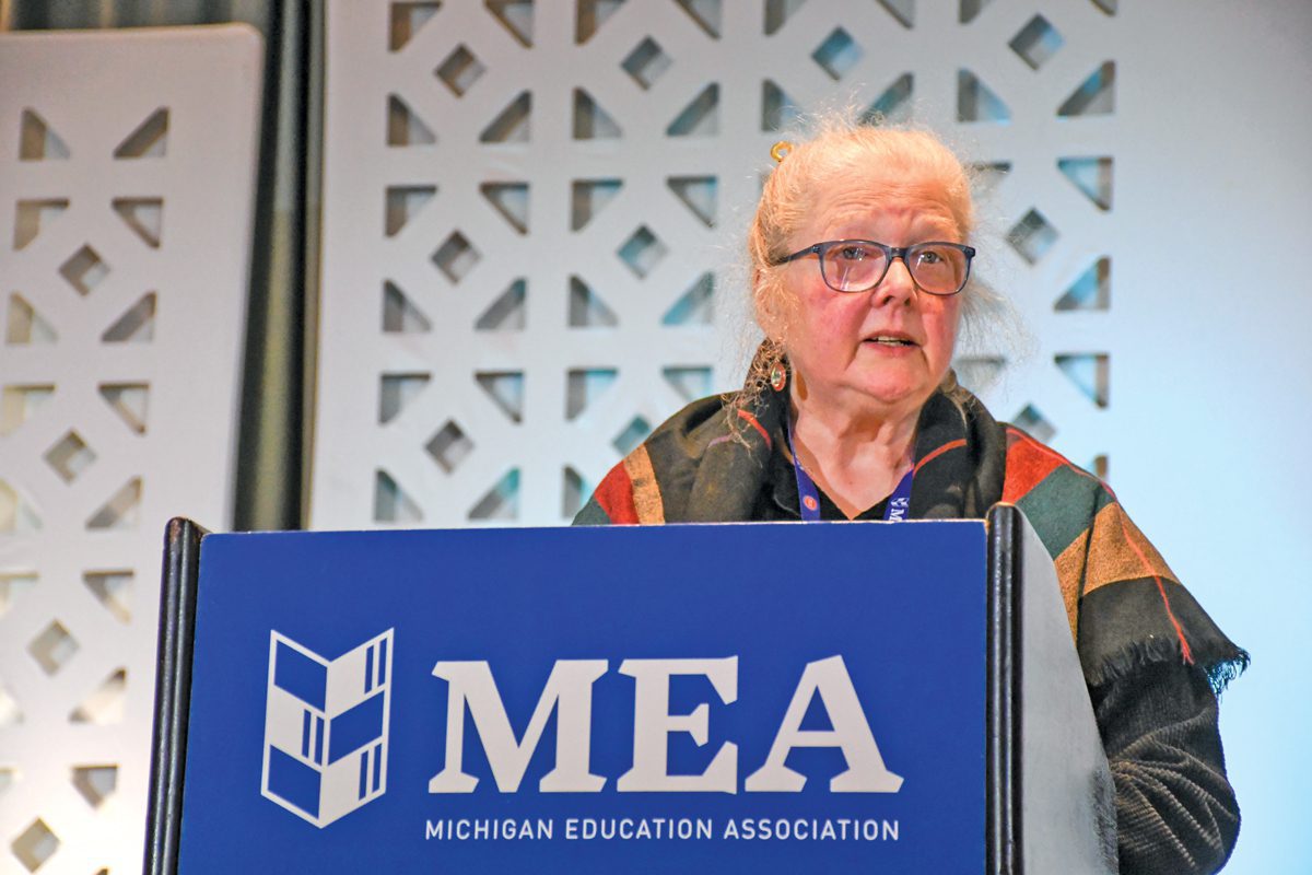 A woman speaks at a podium