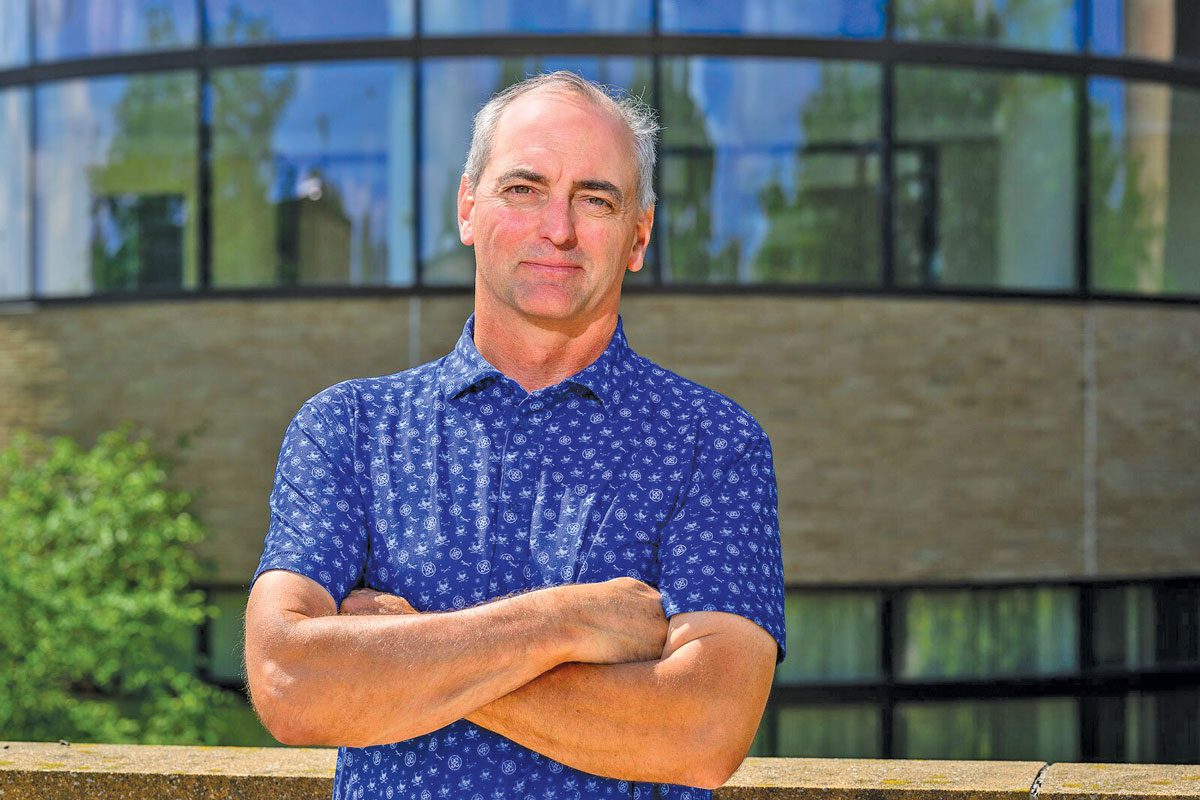 Mark Smith stands in front of Mi-HQ