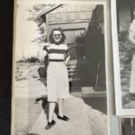 Snapshot of a young Margaret Laird in front of a house