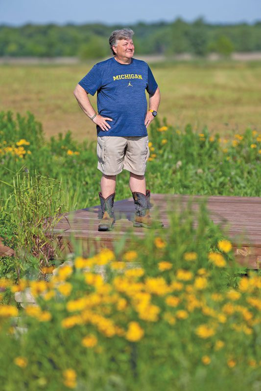 Jeff Parness stands in a field.