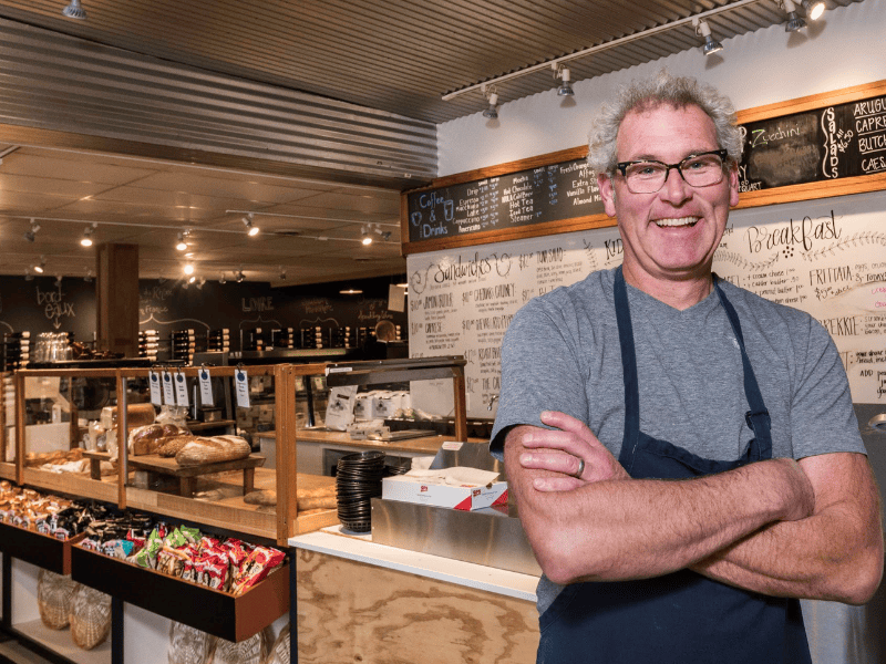 man in front of store counter
