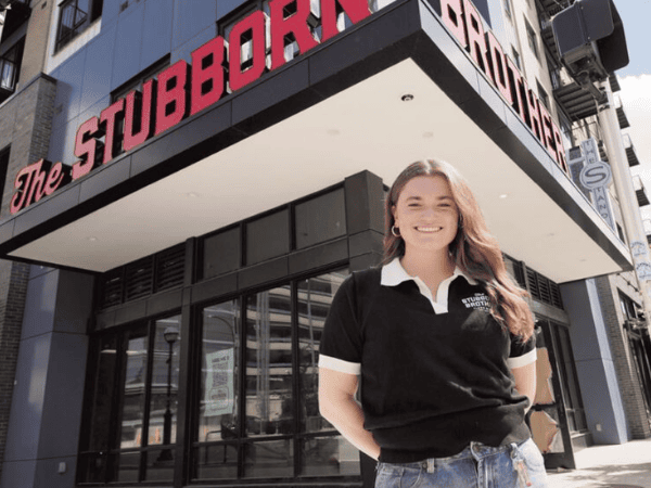 woman in front of restaurant