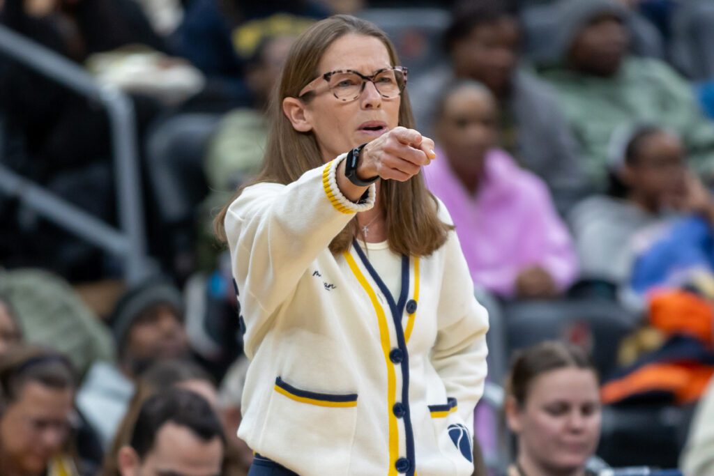 Kim Barnes Arico points during a game.
