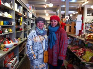 Margaret Parker and Jeanne Hodesh stand in Downtown Home & Garden wearing Pendleton coats.