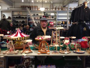 Mark Hodesh stands in Downtown Home & Garden with Christmas ornaments.