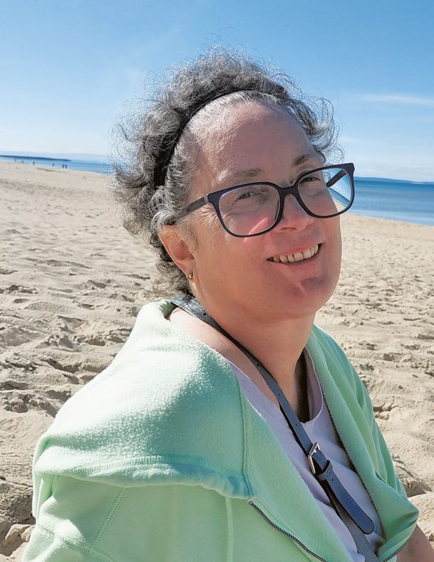 Portrait of Benedette Palazzola smiling at the beach